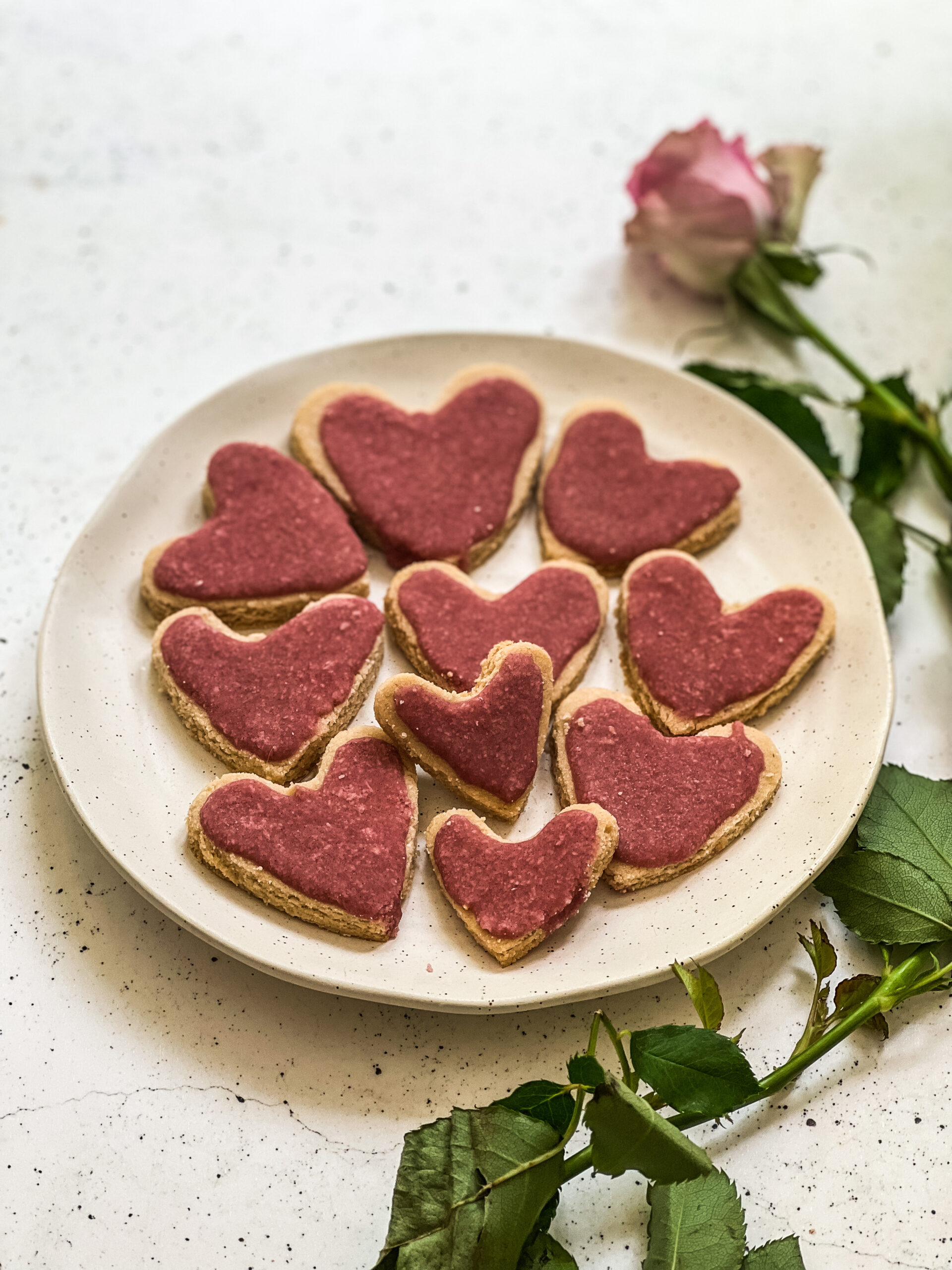 cookies shapes in a love heart with pink icing